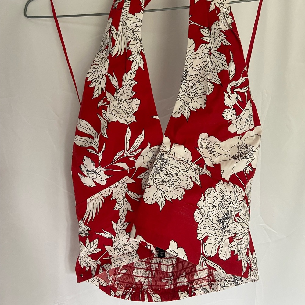 Red and white floral crop halter top. Adjustable tie around neck. Never worn